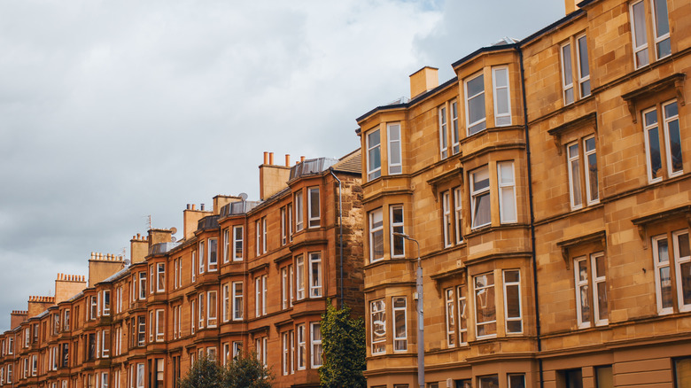 The facade of historic tenement buildings in Glasgow, Scotland
