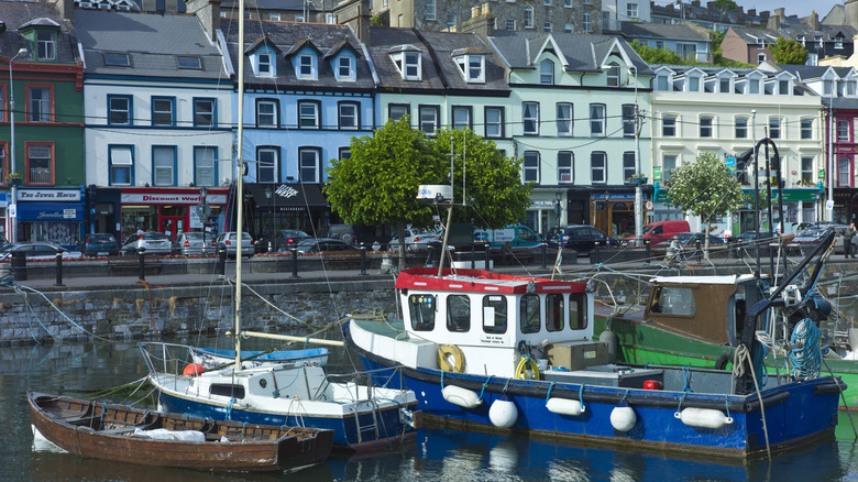 brightly colored houses and fishing boats in Cobh Ireland