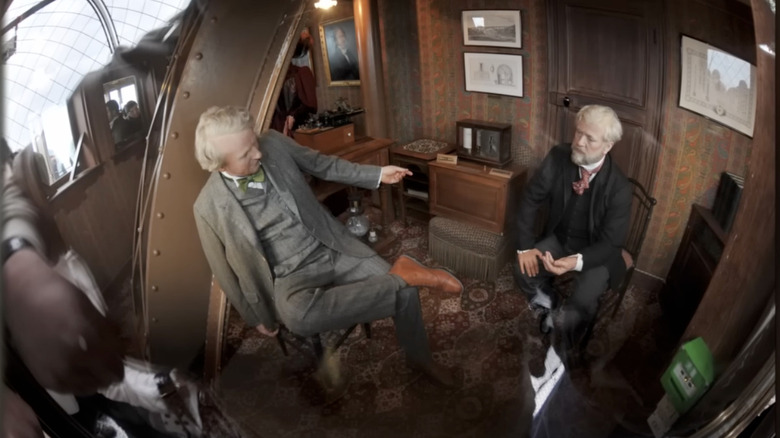 Models seated inside Eiffel Tower apartment