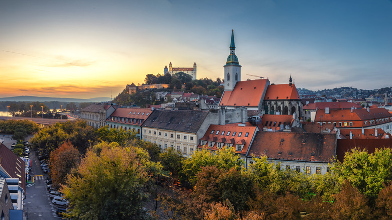 View of Bratislava historic center with St. Martin's Cathedral and Bratislavský hrad castle after sunset