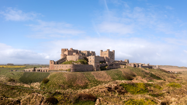 Aerial view of Bamburgh castle and sand dunes on the Northumberland coast