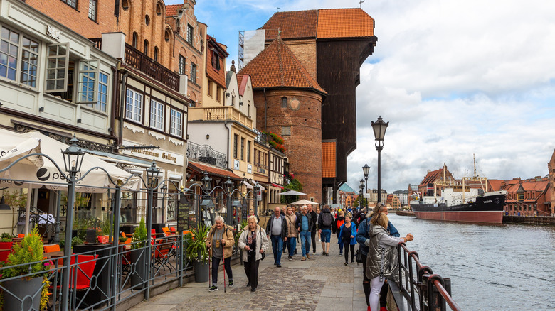 People enjoying the river walk in Gdansk