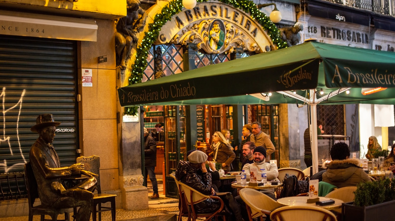 people enjoying a meal at a restaurant in Portugal