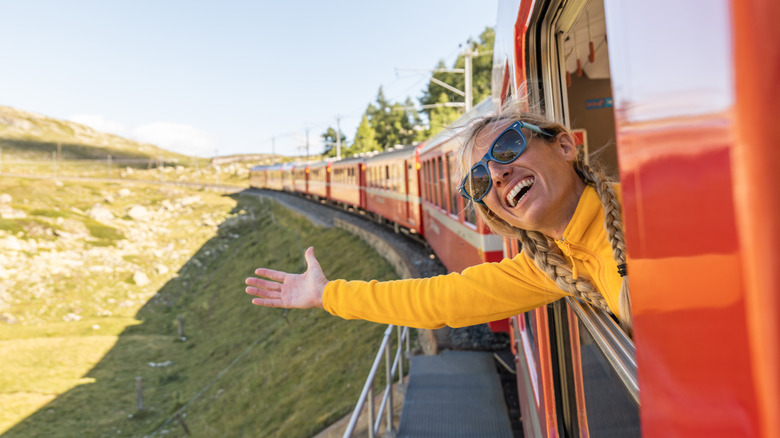 happy woman riding train