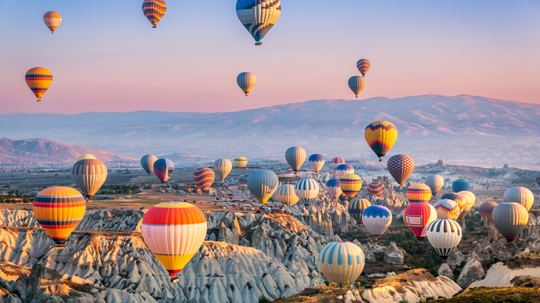 Hot-air balloons floating above Cappadocia