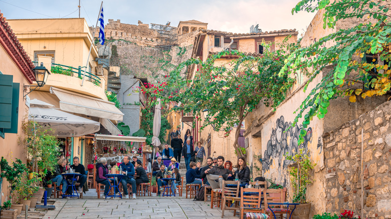 Sidewalk cafe in Plaka on a narrow paved street