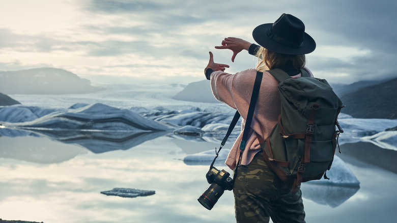 tourist taking photos in Iceland