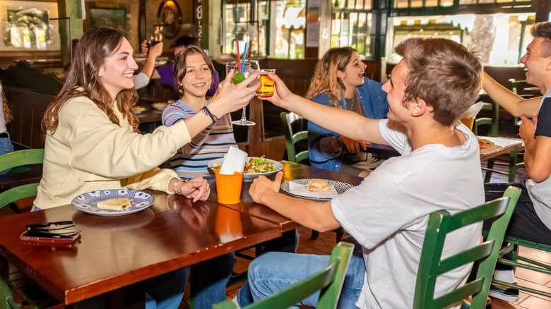 A group of friends eating at a pub.