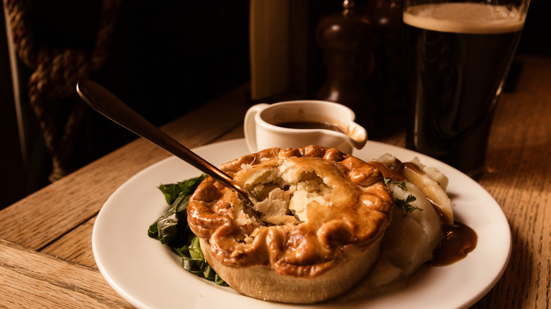Pub pie with gravy and a side of Guinness.
