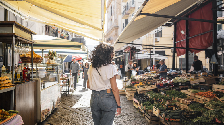 Woman walking through a market