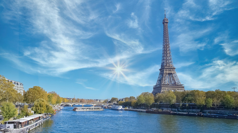 Paris, the Eiffel Tower, with the Seine and houseboats