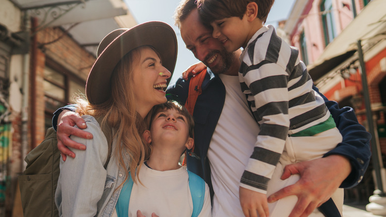 Family smiling together on vacation