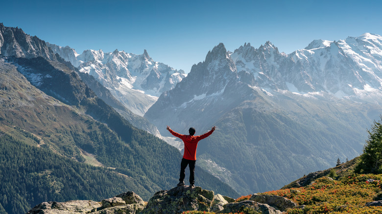 Hiker in front of Mont Blanc mountain range view