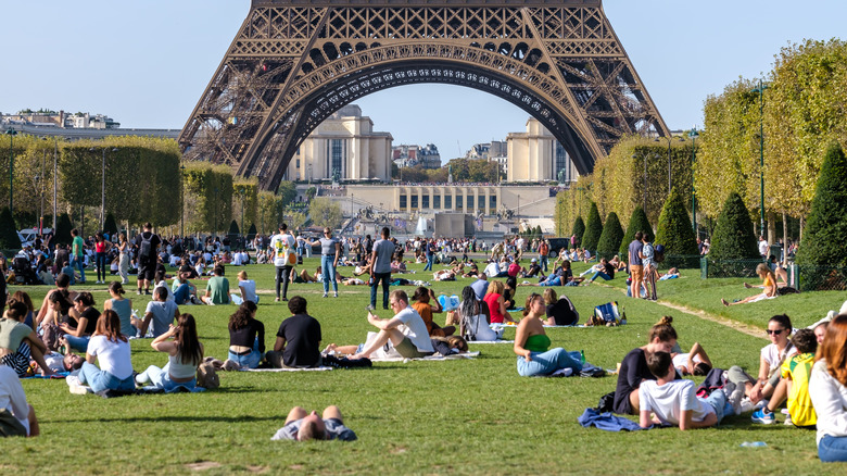 People picnicking under Eiffel Tower