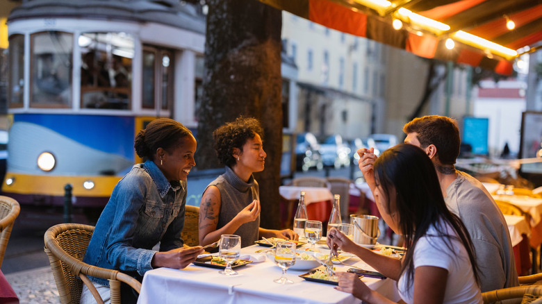 Group of friends enjoying a meal in Portugal