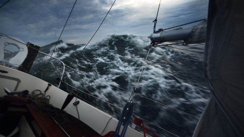 a sailboat in a strong storm at sea