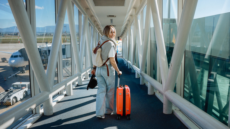 Happy passenger boarding plane