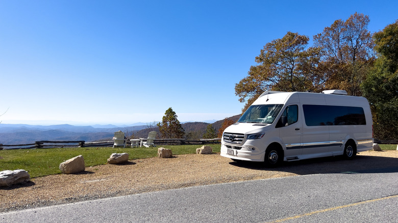 A camper-van is parked near a Blue Ridge Parkway lookout point