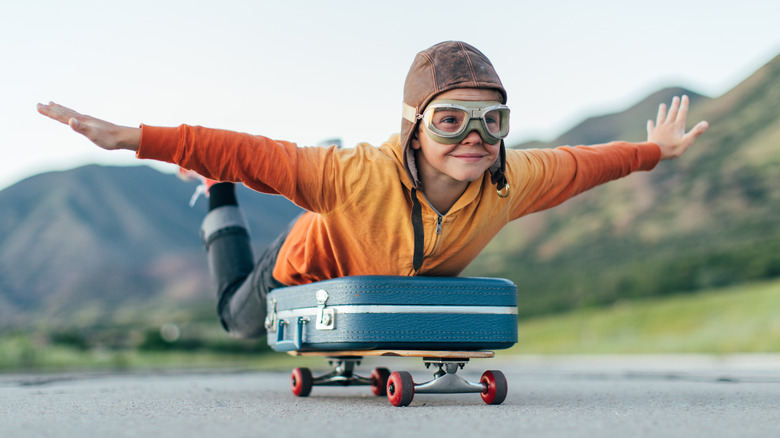 boy taking flight on skateboard