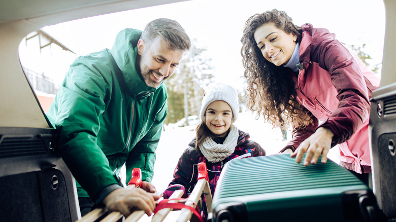 Family packng for a winter road trip 