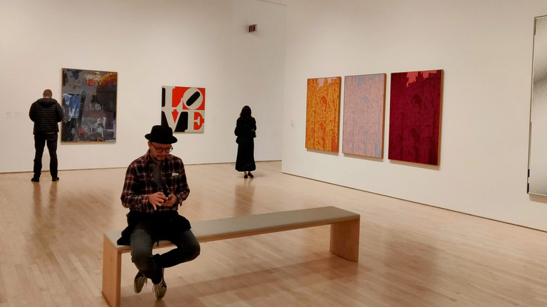 Three people in the SFMOMA looking at art
