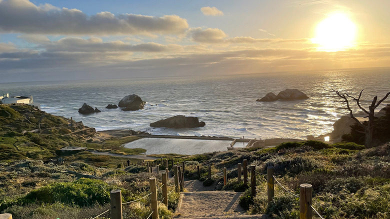 A view of the sunset over the Pacific Ocean at the Sutro Baths in San Francisco