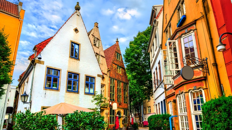 A small European neighborhood with narrow streets and colorful, tiny buildings