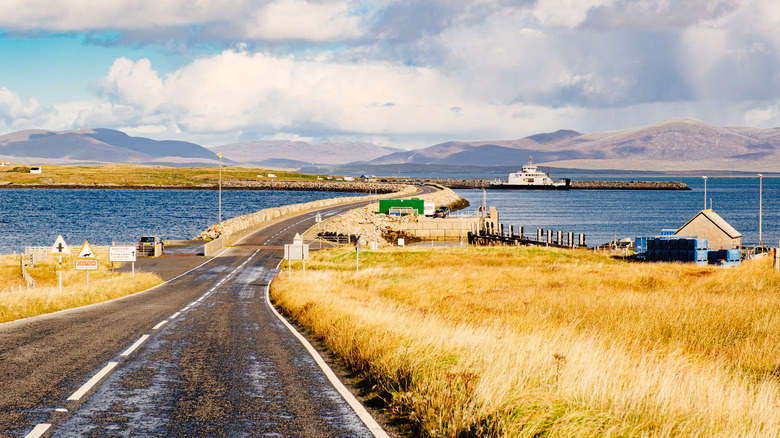 A road curves into a causeway by Beneray, Scotland