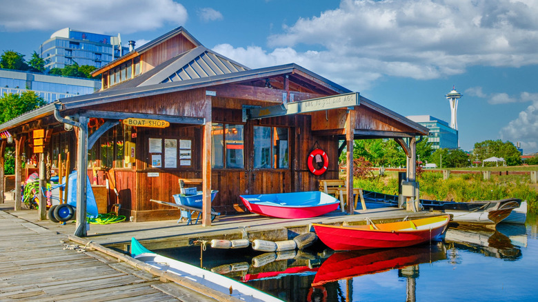 Wood building with small boats, dock