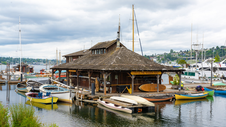 Wooden building surrounded by boats, docks