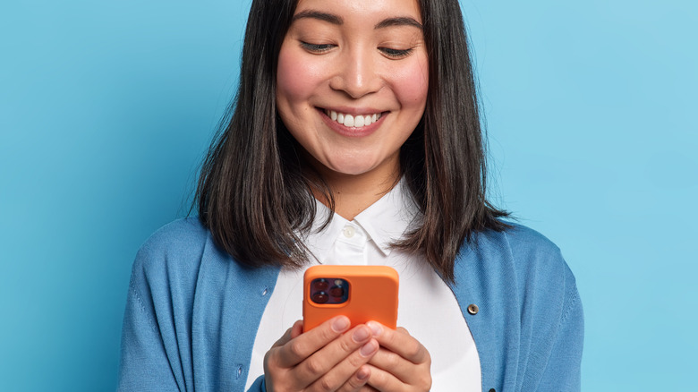 woman holding iphone