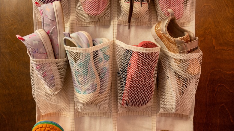 Assorted shoes stored in pocket organizers