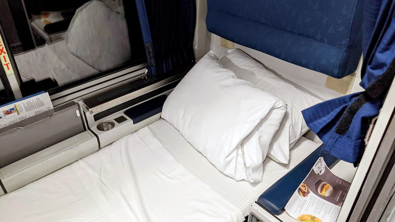 A bed set up within an Amtrak train's roomette