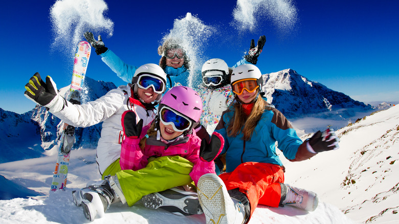 Family with skis on mountain