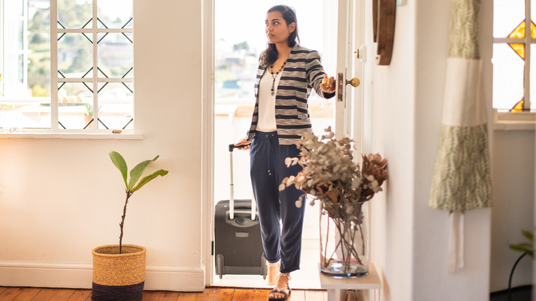 woman coming home from vacation