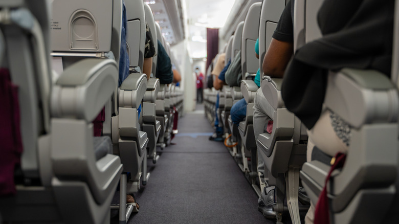 passengers seated on aircraft