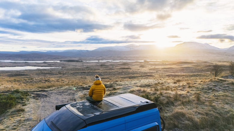 A person solo camping in the wilderness.