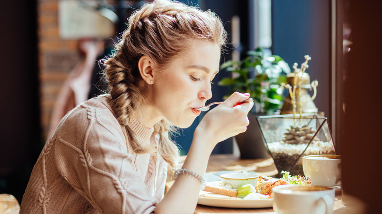 woman eating alone