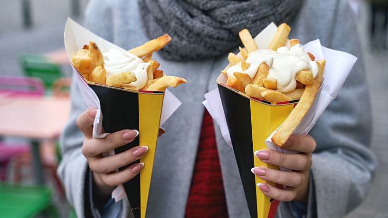 Lady holding French fries
