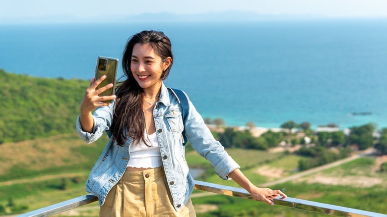 Happy lady taking selfies