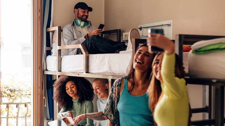 Excited travelers in a hostel