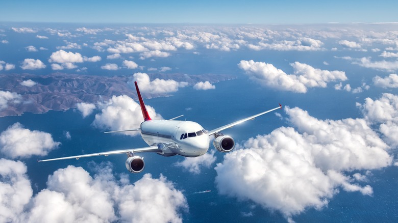 Plane flying through clouds