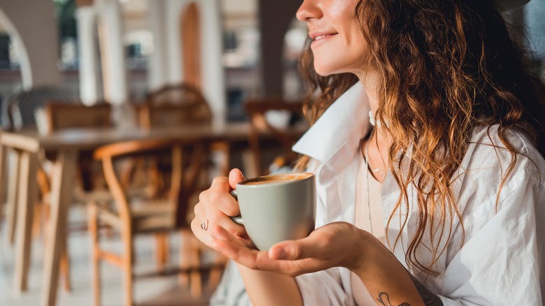 woman drinking coffee in Amsterdam