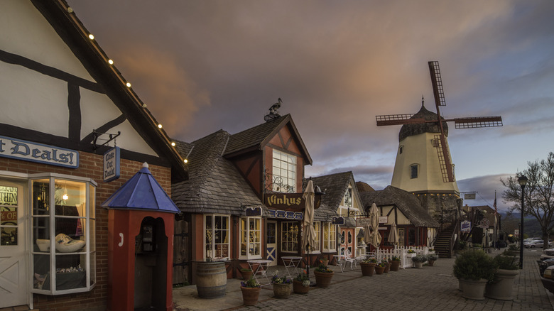 Timbered buildings and windmill at dusk in Solvang