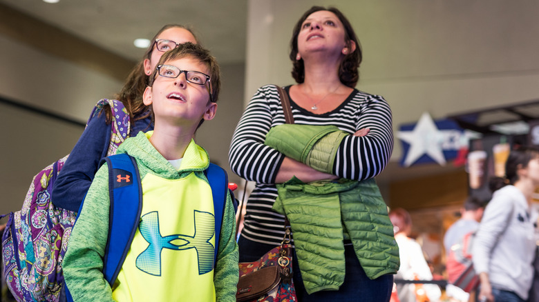 Family arriving at airport in Dallas