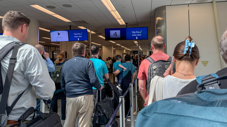 Long line at busy airport security checkpoint