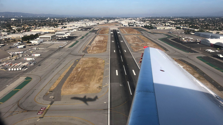 The view from a plane window taking off from Burbank Airport.