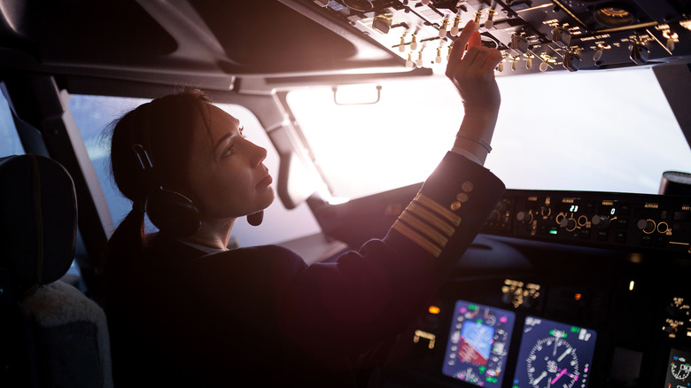 A plane pilot in the cockpit.