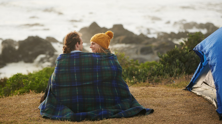Campers wrapped in blanket