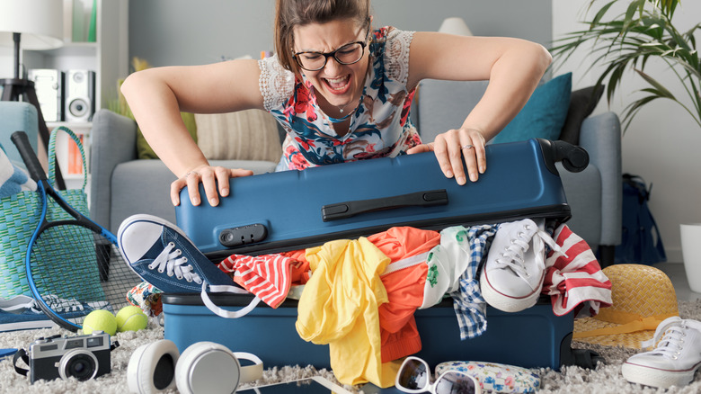 overpacker with fulls suitcase